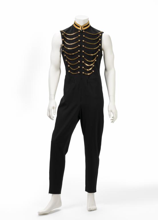 JEAN PAUL GAULTIER, Paris (fashion house)<br />
 Jean Paul GAULTIER (designer)<br/>
<em>Jumpsuit</em> 1990-1991 {autumn-winter, Les Pieds Nickelés collection} <!-- (front) --><br />

wool, rayon, metal, metallic thread, felt<br />
159.0 cm (centre back) 81.0 cm (inner leg)<br />
National Gallery of Victoria, Melbourne<br />
Kaiser Bequest, 2001<br />
2001.146<br />

<!--67963--><br/><a class="col-link block" href="/explore/collection/work/67963"><strong>Collection page <i class="fa fa-angle-right"></i></strong></a>
