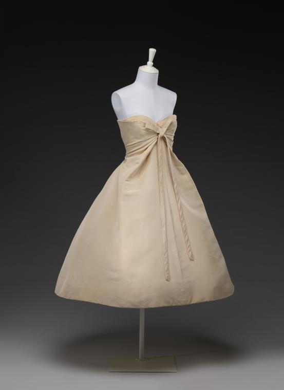 CHRISTIAN DIOR, Paris (couture house)<br />
 Christian DIOR (designer)<br/>
<em>Monte Carlo</em> 1956 {spring-summer} <!-- (front 3/4) --><br />

silk (faille), cotton (tulle), metal (zip)<br />
(a) 100.0 cm (centre back) 35.0 cm (waist, flat) (dress) (b) 65.0 cm (centre back) 35.0 cm (waist flat) (petticoat)<br />
National Gallery of Victoria, Melbourne<br />
Gift of Linda Fisher Dora, 2016<br />
2016.360.a-b<br />
&copy; Christian Dior Couture
<!--118229--><br/><a class="col-link block" href="/explore/collection/work/118229"><strong>Collection page <i class="fa fa-angle-right"></i></strong></a>