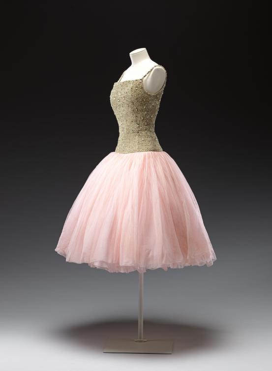 CHRISTIAN DIOR, Paris (couture house)<br />
 Christian DIOR (designer)<br/>
<em>Cuba, evening dress</em> 1954 {H&ndash;line, autumn-winter 1954&ndash;55} <!-- (front 3/4) --><br />

silk (tulle), diamant&eacute;, metallic thread<br />
124.0 cm (centre back) 29.5 cm (waist, flat)<br />
National Gallery of Victoria, Melbourne<br />
Purchased with funds donated by Mrs Krystyna Campbell-Pretty in memory of Mr Harold Campbell-Pretty, 2015<br />
2015.614<br />
&copy; Christian Dior Couture
<!--117202--><br/><a class="col-link block" href="/explore/collection/work/117202"><strong>Collection page <i class="fa fa-angle-right"></i></strong></a>