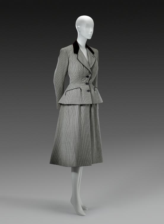 CHRISTIAN DIOR, Paris (couture house)<br />
 Christian DIOR (designer)<br/>
<em>Cavalier, suit</em> 1948 {Flight (Envol) line, spring-summer 1948} <!-- (front 3/4) --><br />

wool, silk (velvet)<br />
(a) 32.0 cm(centre back) 58.5 cm (sleeve length) (jacket) (b) 31.5 cm (waist, flat) 70.0 cm (centre back) (skirt)<br />
National Gallery of Victoria, Melbourne<br />
Purchased with funds donated by Mrs Krystyna Campbell-Pretty in memory of Mr Harold Campbell-Pretty, 2015<br />
2015.610.a-b<br />
&copy; Christian Dior Couture
<!--117174--><br/><a class="col-link block" href="/explore/collection/work/117174"><strong>Collection page <i class="fa fa-angle-right"></i></strong></a>