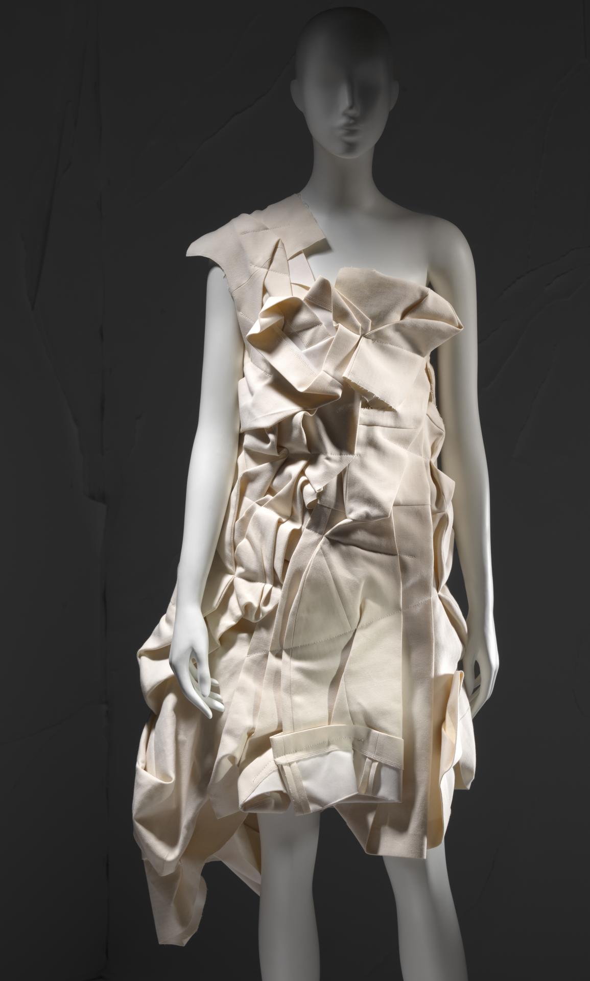 COMME DES GARÇONS, Tokyo (fashion house)<br />
 Rei KAWAKUBO (designer)<br/>
<em>Dress</em> 2012 {Crush collection, spring-summer 2013} (detail)<br />

cotton, polyester<br />
89.0 cm (centre back) 44.0 cm (waist, flat)<br />
National Gallery of Victoria, Melbourne<br />
Gift of Takamasa Takahashi, 2019<br />
2019.945<br />
© Comme des Garçons
<!--141336-->