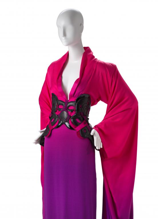 ALEXANDER MCQUEEN, London (fashion house)<br />
 Alexander McQUEEN (designer)<br/>
<em>Gown, belt and sandals</em> 2007 {The blue lady (La Dame Bleue) collection, spring-summer 2008} (detail)<br />

silk (satin), patent leather, leather, synthetic fabric (shoulder pads, wadding), cotton (laces), metal (fastenings), rubber<br />
(a) 176.0 cm (centre back) 33.5 cm (waist, flat) (dress) (b) 37.0 x 61.0 cm (belt) (c-d) 23.0 x 19.5 x 80.0 cm (each) (sandals)<br />
National Gallery of Victoria, Melbourne<br />
Gift of Krystyna Campbell-Pretty AM and Family through the Australian Government’s Cultural Gifts Program, 2021<br />
2021.99.a-d<br />
© Alexander McQueen
<!--145458--><br/><a class="col-link block" href="/explore/collection/work/145458"><strong>Collection page <i class="fa fa-angle-right"></i></strong></a>
