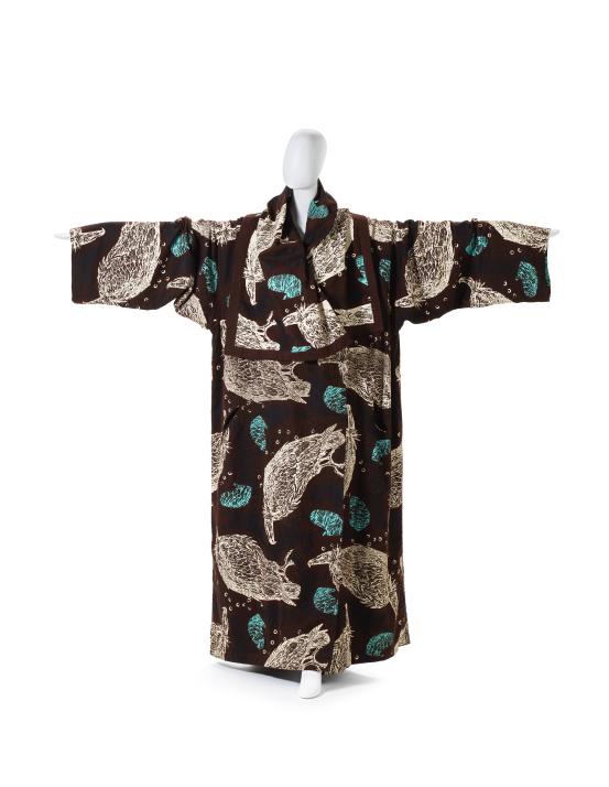 JOHN GALLIANO, London (fashion house)<br />
 John GALLIANO (designer)<br/>
<em>Coat</em> 1985 {The ludic game collection, autumn-winter 1985–86} <!-- (front) --><br />

screenprinted cotton (flannelette), plastic (buttons)<br />
158.0 cm (centre back) 70.0 cm (sleeve length) <br />
National Gallery of Victoria, Melbourne<br />
Gift of Krystyna Campbell-Pretty AM and Family through the Australian Government’s Cultural Gifts Program, 2023<br />
2023.712<br />

<!--152091--><br/><a class="col-link block" href="/explore/collection/work/152091"><strong>Collection page <i class="fa fa-angle-right"></i></strong></a>