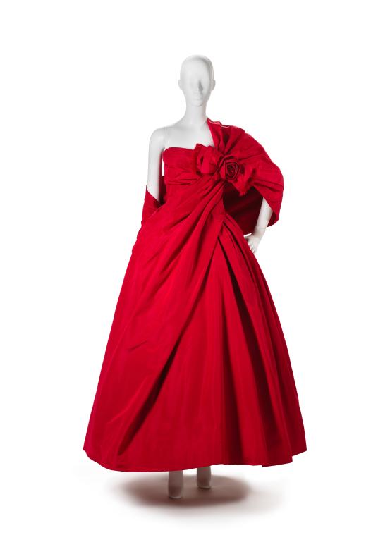 CHRISTIAN DIOR, Paris (couture house)<br />
 Yves SAINT LAURENT (designer)<br />
 ASCOTT, Paris (shoemaker)<br/>
<em>Look 150, Rose rouge, evening dress, bag and shoes</em> 1958 {Trapeze line, spring-summer 1958} <!-- (front) --><br />

silk, tulle (synthetic), leather, elastance, plastic (boning), rubber, metal (fastenings)<br />
(a) 121.5 cm (centre back) 35.5 cm (waist, flat) (evening dress) (b) 27.0 cm cm (waist,flat) 75.0 cm (centre back) (petticoat) (c) 30.0 cm (waist,flat) 75.0 cm (centre back) (petticoat) (d-e) 14.5 x 7.5 x 20.5 cm (shoes) (f)13.5 x 27.0 x 2.5 cm (bag)<br />
National Gallery of Victoria, Melbourne<br />
David Richards Bequest, 2021<br />
2021.285.a-f<br />

<!--146611--><br/><a class="col-link block" href="/explore/collection/work/146611"><strong>Collection page <i class="fa fa-angle-right"></i></strong></a>