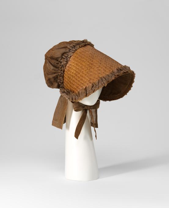 FRANCE<br/>
<em>Bonnet</em> (c. 1806) <!-- (full view) --><br />

straw, cotton<br />
27.0 x 14.0 x 37.0 cm<br />
National Gallery of Victoria, Melbourne<br />
Gift of Krystyna Campbell-Pretty AM and Family through the Australian Government&rsquo;s Cultural Gift Program, 2025<br />
2025.738<br />

<!--156866-->