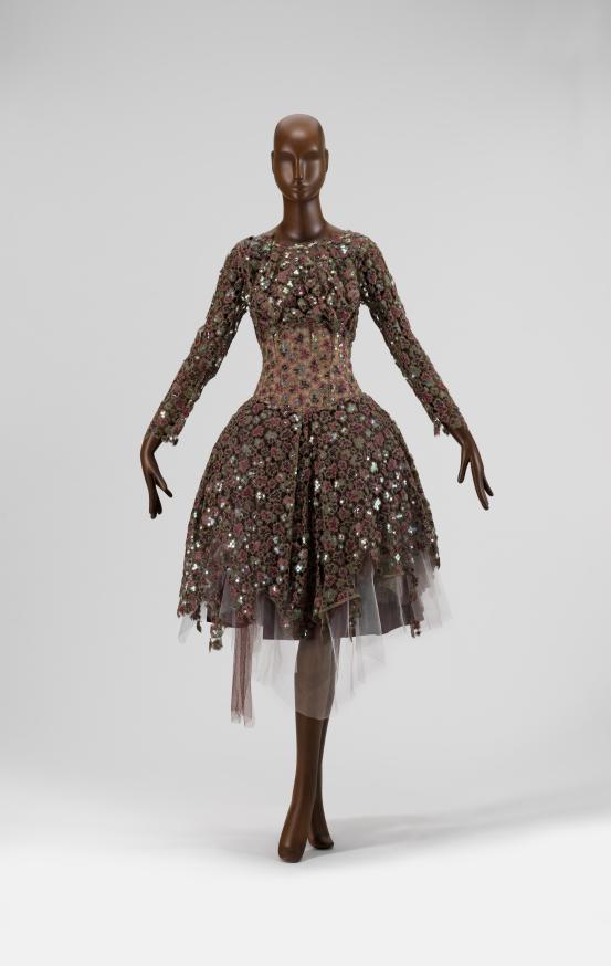 VIVIENNE WESTWOOD, London (fashion house)<br />
 Vivienne WESTWOOD (designer)<br/>
<em>Dress</em> 2007 {Wake up cave girl collection, autumn-winter 2007&ndash;08} <!-- (full view) --><br />

silk, nylon (tulle, mesh), plastic (sequins), metallic thread, nylon and metal (fastenings)<br />
(a) 32.0 cm (waist, flat) 100.0 cm (centre back) (dress) (b) 29.0 cm (waist, flat) 70.0 cm (centre back) (petticoat)<br />
National Gallery of Victoria, Melbourne<br />
Gift of Krystyna Campbell-Pretty AM and Family through the Australian Government&rsquo;s Cultural Gift Program, 2025<br />
2025.595.a-b<br />

<!--156611-->