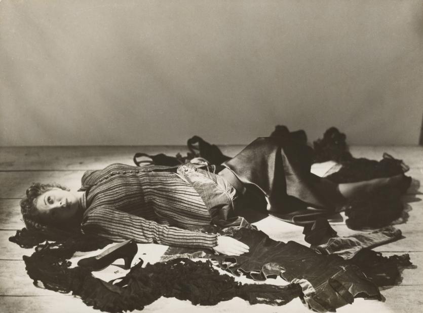 Dora MAAR<br/>
<em>L&eacute;onor Fini lying on a floor strewn with clothes</em> (c. 1936) <!-- (recto) --><br />
<em>(L&eacute;onor Fini allong&eacute;e sur un plancher jonch&eacute; de v&ecirc;tements)</em><br />
gelatin silver photograph<br />
18.0 x 24.3 cm (image and sheet)<br />
National Gallery of Victoria, Melbourne<br />
Gift of Krystyna Campbell-Pretty AM and Family through the Australian Government's Cultural Gifts Program, 2021<br />
2021.261<br />
&copy; Dora Maar. Licensed by Copyright Agency, Australia
<!--145753-->

