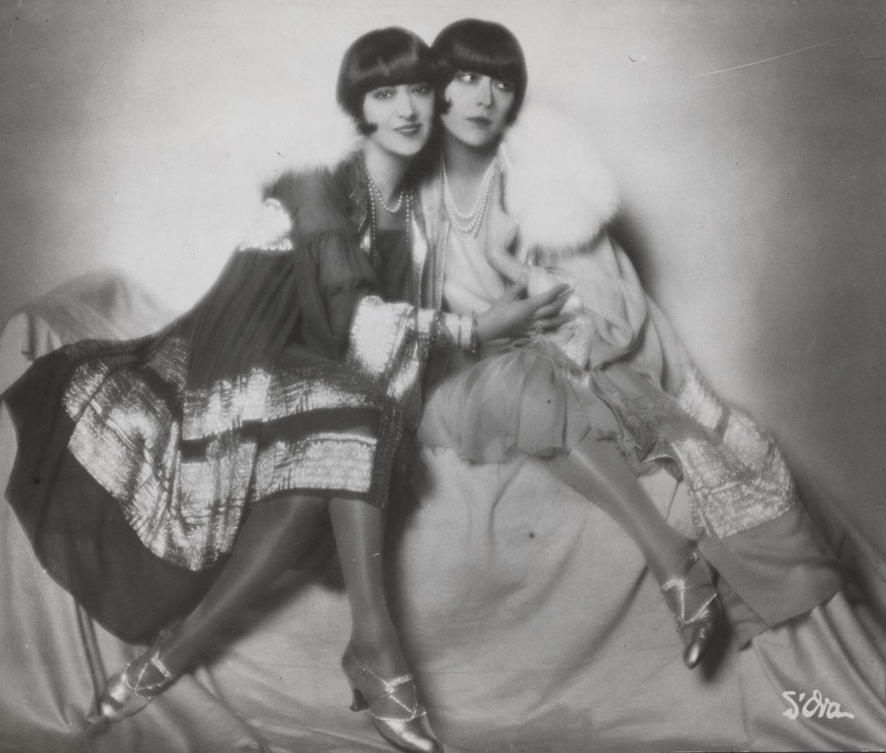 MADAME d&rsquo;ORA<br/>
<em>The Dolly sisters</em> (c. 1928) <!-- (recto) --><br />

gelatin silver photograph<br />
(18.0 x 21.1cm)<br />
National Gallery of Victoria, Melbourne<br />
Bowness Family Fund for Photography, 2022<br />
2022.900<br />
&copy; the Artist's Estate
<!--149674-->
