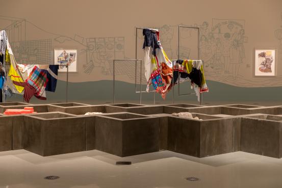 Tatiana BILBAO (architect)<br />
 TATIANA BILBAO ESTUDIO, Mexico City (architecture studio)<br />
 AUGRC, Melbourne (manufacturer)<br />
 DALE HOLDEN STUDIO, Melbourne (manufacturer)<br/>
<em>Dirty clothes are washed at home</em> (2022) <!-- (installation) --><br />
<em>(La ropa sucia se lava en casa)</em><br />
glass-reinforced concrete, cotton, soap, steel, fabric, synthetic poymer paint on existing wall, collage of cut printed paper, photographs, fabric, wool (yarn, thread), cotton (lace, yarn, thread), tissue paper and jute (string), synthetic polymer paint, metallic paint and fibre-tipped pen<br />
(364.0 x 1911.0 x 1911.0 cm) (installation)<br />
National Gallery of Victoria, Melbourne<br />
Purchased with funds donated by Jo Horgan and MECCA Brands, 2022<br />
2022.1546<br />
&copy; Tatiana Bilbao ESTUDIO
<!--149710-->