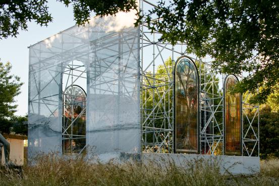 JR<br/>
<em>Homily to Country</em> (2020-2021) <!-- (installation view ) --><br />

steel, wood, printed glass, aluminium, paint, self-adhesive vinyl, polyvinyl chloride, colour digital video, sound<br />
(1) (424.4 x 175.4 x 0.3 cm) (Homily to Country, Badger, stained glass, Australia, 2020) (2) (424.4 x 175.4 x 0.3 cm) (Homily to Country, Rachel Strachan, stained glass, Australia, 2020) (3) (424.4 x 175.4 x 0.3 cm) (Homily to Country, Alan Whyte, stained glass, Australia, 2020) (4) (424.4 x 175.4 x 0.3 cm) (Homily to Country, Kamuru #1, stained slass, Australia, 2020) (5) (424.4 x 175.4 x 0.3 cm) (Homily to Country, Kamuru #2, stained glass, Australia, 2020) (6) 6 min 3 sec (Homily to Country)<br />
National Gallery of Victoria, Melbourne<br />
Commissioned by the National Gallery of Victoria, Melbourne Loti & Victor Smorgon Fund, 2021<br />
2021.783<br />
&copy; JR
<!--148334-->