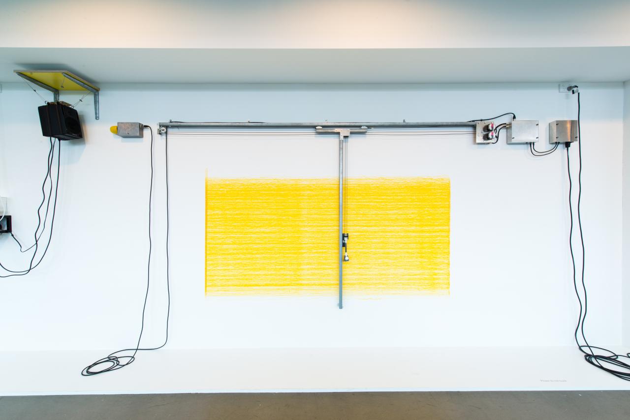 Angela BULLOCH<br/>
<em>Short, big, yellow drawing machine</em> (2012) (still)<br />

fibre-tipped pen, metal, plastic, microphone, speaker, synthetic strapping, electrical cables, sound<br />
231.5 x 579.0 x 45.0 cm<br />
National Gallery of Victoria, Melbourne<br />
Yvonne Pettengell Bequest, 2013<br />
2013.781<br />
© Angela Bulloch. Courtesy of the artist and Simon Lee Gallery, London / Hong Kong
<!--108478-->