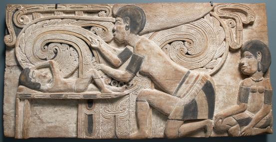 John Kasaipwalova<br />
 Massim people, Trobriand Islands, Milne Bay Province, Papua New Guinea<br/>
<em>Yolina is born at Muruwa</em> 1979 <!-- (front view) --><br />
from the <i>Sail the Midnight Sun</i> series 1979<br />
earth pigments on wood<br />
73.2 x 146.7 x 7.8 cm<br />
National Gallery of Victoria, Melbourne<br />
Purchased, 2003<br />
2003.176.1<br />
© the artist
<!--74232--><br/><a class="col-link block" href="/explore/collection/work/74232"><strong>Collection page <i class="fa fa-angle-right"></i></strong></a>