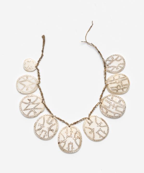 Santa Cruz Islands, Temoto Province, Solomon Islands<br/>
<em>Kapkap necklace</em> (early 20th century) <!-- (full view) --><br />

shell, earth pigment, fibre<br />
18.3 x 20.9 x 0.7 cm<br />
National Gallery of Victoria, Melbourne<br />
Gift of Mr James A. Davidson, 1979<br />
O123-1979<br />

<!--2041-->