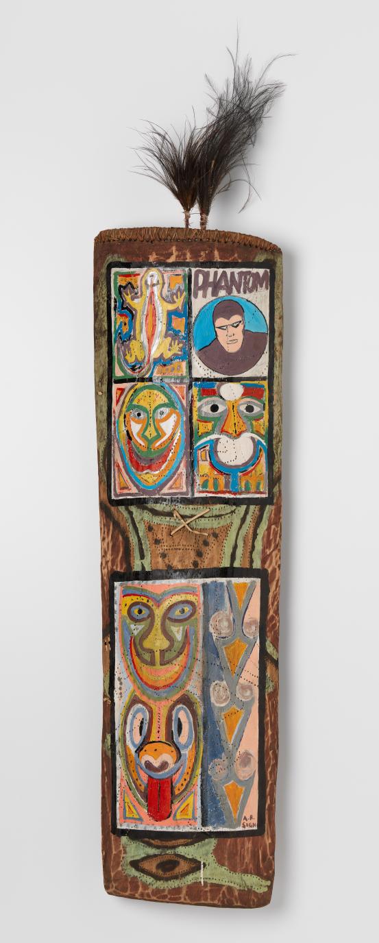 John Wahgi<br/>
<em>Shield</em> 2009 <!-- (full view) --><br />

natural pigments and synthetic polymer paint on wood, feathers, cotton, cane<br />
176.7 x 37.0 x 11.0 cm (variable)<br />
National Gallery of Victoria, Melbourne<br />
Gift of Ian Wamijo through the Australian Government&rsquo;s Cultural Gifts Program, 2013<br />
2013.313<br />

<!--107156-->