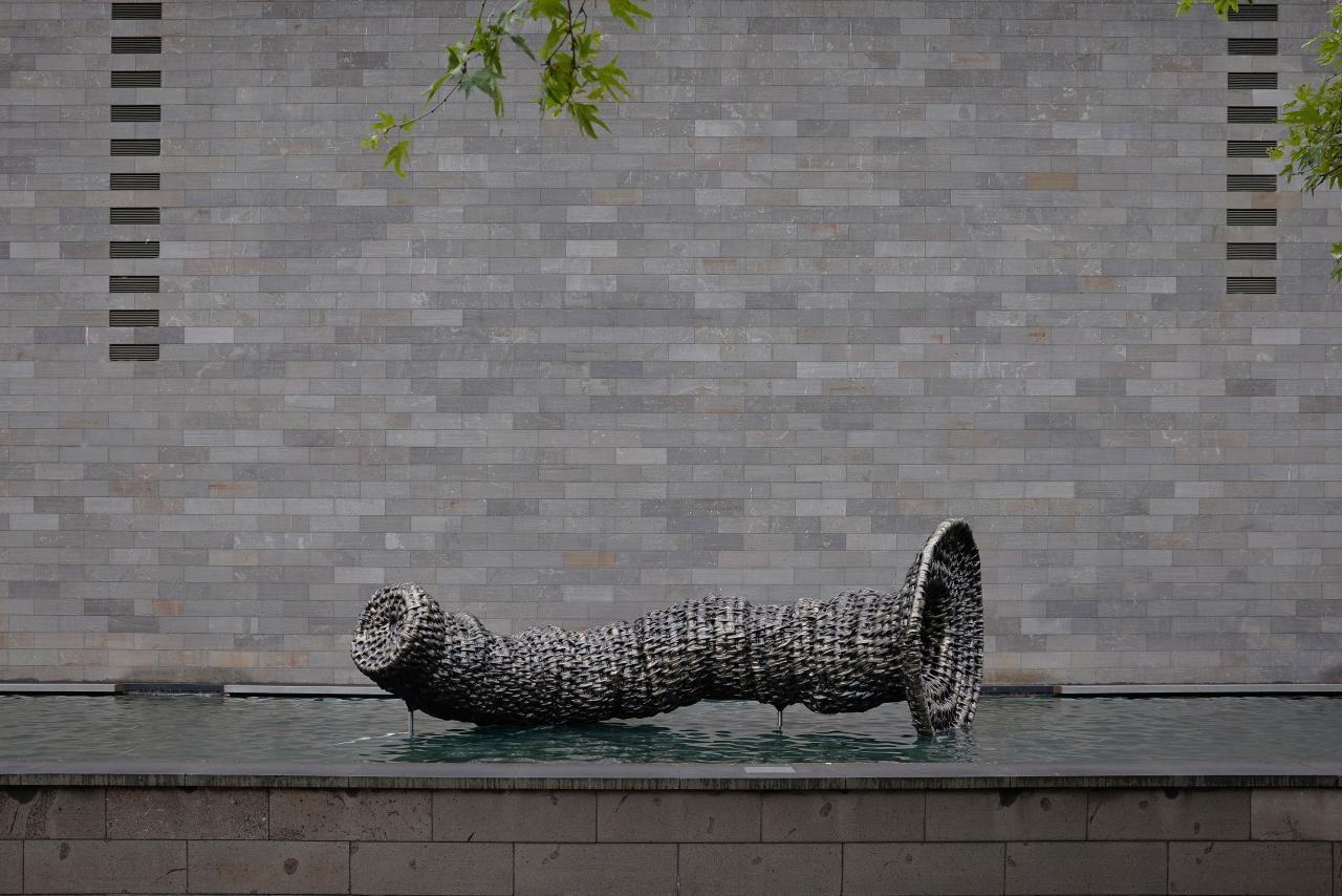 NGV Triennial 2023: eight-metre-long bronze eel trap sculpture by