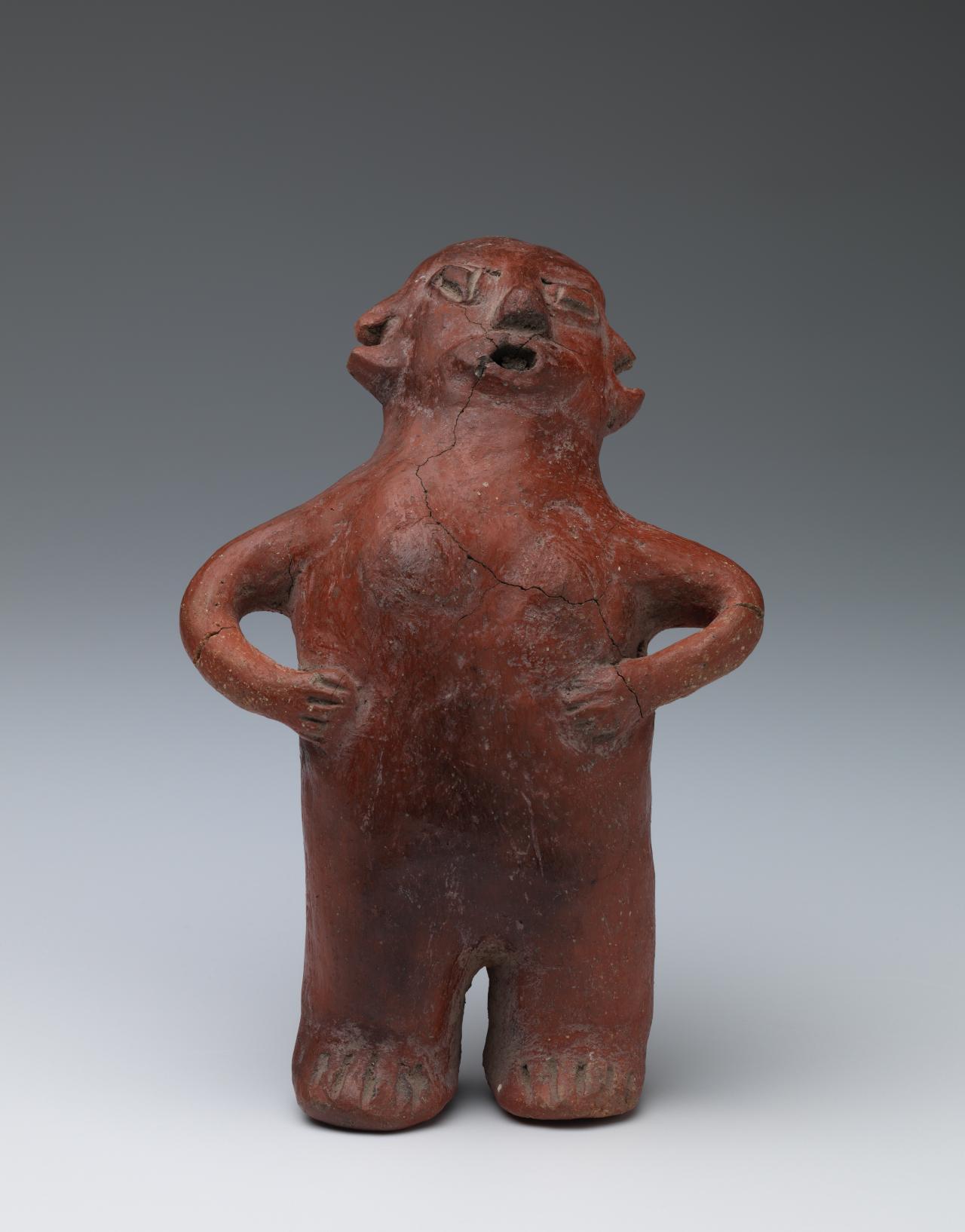 Central Mexico<br/>
<em>Standing figure</em> Middle Formative 800 BCE-300 BCE <!-- () --><br />

earthenware<br />
22.6 x 14.5 x 10.1 cm<br />
National Gallery of Victoria, Melbourne<br />
Presented anonymously, 1980<br />
PC68-1980<br />

<!--373-->