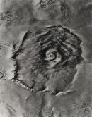 Mars. Nix Olympica; a gigantic volcanic mountain photographed by Mariner 9 in late January